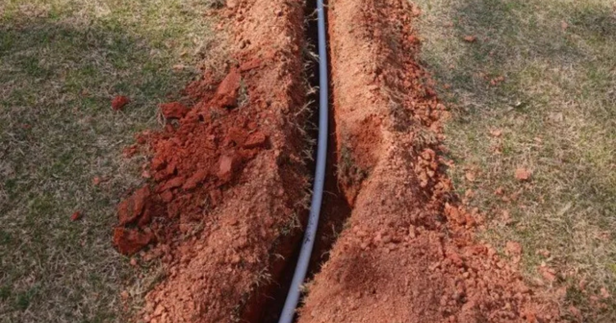 Irrigation services technician working in a South Metro Atlanta yard