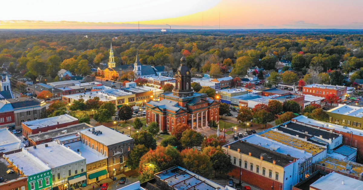 Freshly installed sprinkler heads watering a Newnan front lawn